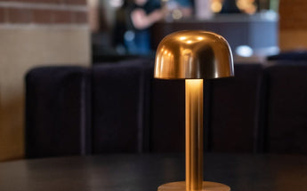 Humble cordless lamps on a restaurant table