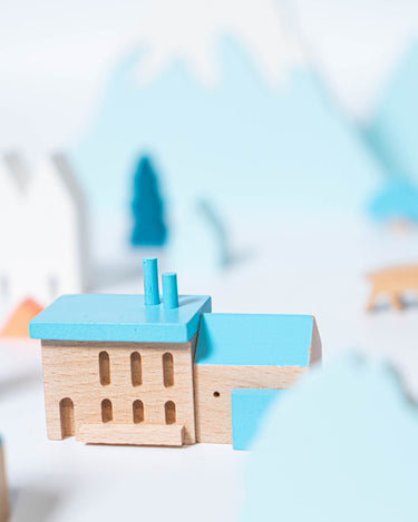Landscape Blocks Medium by Eguchi Toys, blue-roof house and trees in a snowy scene
