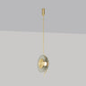 Pendulum pendant light in satin brass with a smoked glass shade, studio view