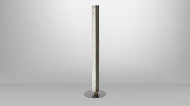 Artes floor lamp in bronze with a column of honed alabaster on a dark round base, studio view
