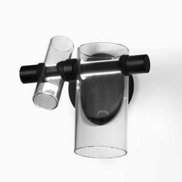 Oluce Dancing Glass wall lamp in transparent glass, studio shot