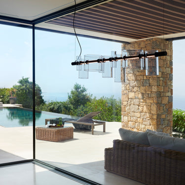 Oluce Dancing Glass suspension lamp in transparent glass, studio shot
