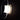 Oluce Yolk wall lamp lit, side view of the opal glass diffuser inside the curved clear glass shell