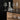 Clear carafe among BELO glasses on a black kitchen counter | BELO by Frederike Martens for blomus