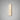 Hepworth wall light in bronze with a rounded honed alabaster panel and a fine dark central line, lit on a grey wall