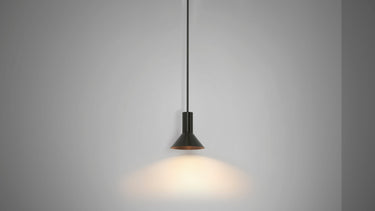 Torres funnelled shade in bronze, shown on its pendant version, throwing light downward