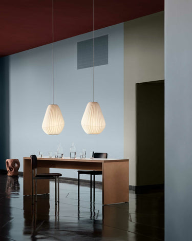 Lit over a dining table | TR31 Pendant by Tom Rossau