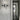 Oluce Dancing Glass wall lamp in smokey grey glass, studio shot