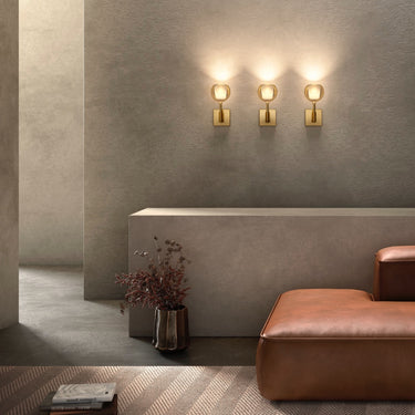 Penta Glo wall sconce by Carlo Colombo, glass sphere on a matt black wall fitting