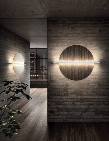 Penta Hang Out wall lamp with a round panel on a dark wall