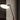 Penta Spoon floor lamp beside an armchair