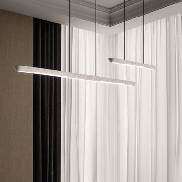Penta Woody pendant light in natural oak over a dining table