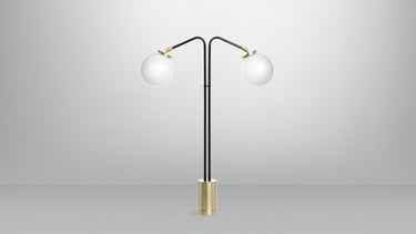 Array twin table lamp in bronze with satin brass details and two opal glass globes, studio view