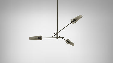 Axis pendant in bronze with 3 conical smoked glass shades, studio view