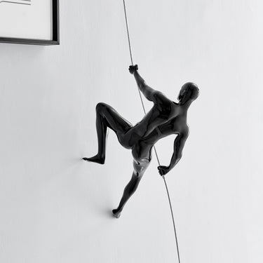 Finesse Decor Glossy Black Wall Sculpture Climbing 15" Man