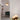 Lucid table lamp with a honed alabaster dome on a brass base, in a room setting