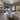 Warm 3000K ambient light cast by the Visual Comfort Photon 48 dimmable starburst chandelier installed in a modern bedroom