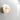 Lucid wall light with a silvered oxidised brass band and honed alabaster dome, mounted on a white wall