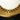 Close-up of the brass inner shade with perforations around the opal glass globe
