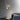 Heron wall light with a cylindrical shade on a short arm, in a room setting