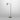 Heron floor lamp in bronze on a metal base, studio view