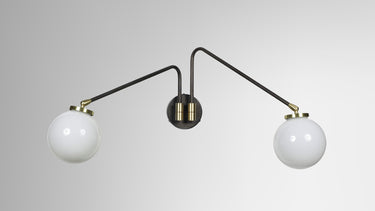 Array wall light in bronze with opal glass globes, studio view. The twin version is shown