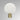 Nimbus wall light in satin brass with a fritted glass disc, studio view