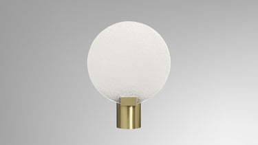Nimbus wall light in satin brass with a fritted glass disc, studio view