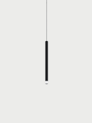 Lodes A-Tube Nano slim LED pendant light in matte black, showcasing its minimalist Italian design and linear profile, ideal for modern dining rooms or kitchen islands.