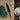 Hand-forged medium kitchen knife beside a pile of chopped greens