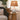 Cordless ceramic lamp providing warm ambient light in living room