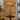 Alexis Cordless Table Lamp, a modern lantern with brass and rattan accents