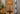 Decorative cordless table lamp with natural rattan shade and antique brass finish