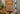 Alexis Cordless Table Lamp's antique brass base and rattan shade