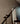 Detail of the Penta Altura floor lamp, steel rods and conical shade