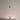 Black Anvil Spot S pendant spotlight above a shelf with a decorative bowl