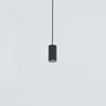 Black Anvil Spot S spot pendant hanging against a pale wall