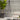 Apex Outdoor Floor Lamps Lighting a Poolside Lounge Area, Black FInish