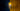 Yellow and brass Aspen pendant against deep blue and gold curtains