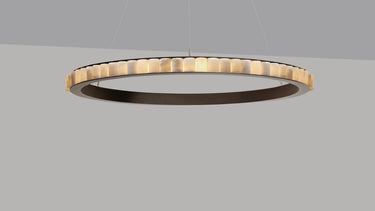 Avalon chandelier, a ring of honed alabaster cylinders in a bronze frame, lit, studio view
