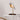 Almond Beige Bird lamp by Daqiconcept on a slim side table