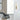 Visual Comfort Modern Banda 13" Wall Light, Brass Finish, Side View in Office Lobby