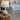 Rechargeable LED table lamp with ivory ceramic body and off-white shade