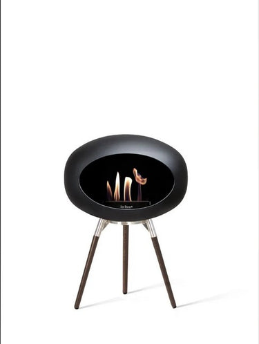 Dome Black Ground Wood Low Fireplace by Le Feu in a modern living room