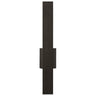 Blade 24" indoor/outdoor wall light, casting a warm 2700K light on a hallway wall.