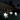 A fleet of illuminated Boat Lamps floating peacefully in a garden pond, creating a magical, multi-colored ambient outdoor lighting display.
