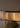 Close-up of the Avalon Oval alabaster cylinders glowing warmly beneath the dark frame