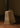 Close-up of the honed travertine base of the Roc lamp with its pitted, sand-colored surface