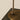 Close-up of the bronze round base and stem of the Heron table lamp
