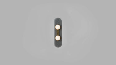 Modulo Wall Twin in satin brass with a smoked glass plate, front studio view